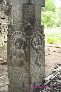 interior pillar of eclipse pavilion at Mahabalipuram with reliefs, dancer and unknown figure